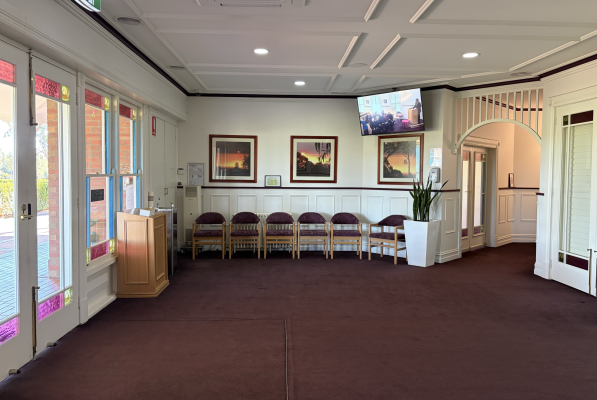 Peaceful Chapel Setting With Wooden Pews and Altar in Melbourne