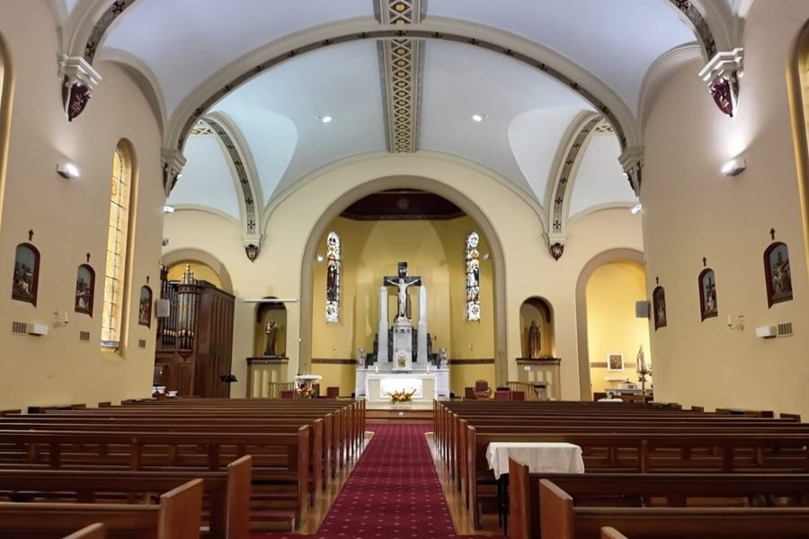 Peaceful Chapel Setting With Wooden Pews and Altar in Melbourne